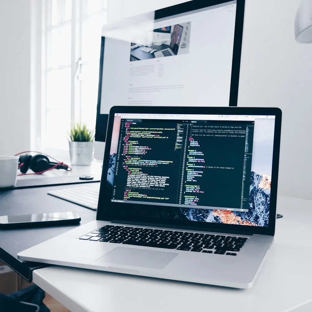 Rudra Patel's development workspace — Node.js and MongoDB code on a laptop